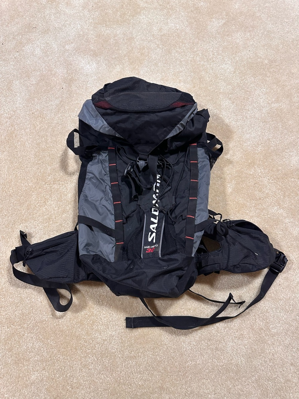 Salomon Black & Gray Outdoor Hiking Backpack with Subtle Red Accents